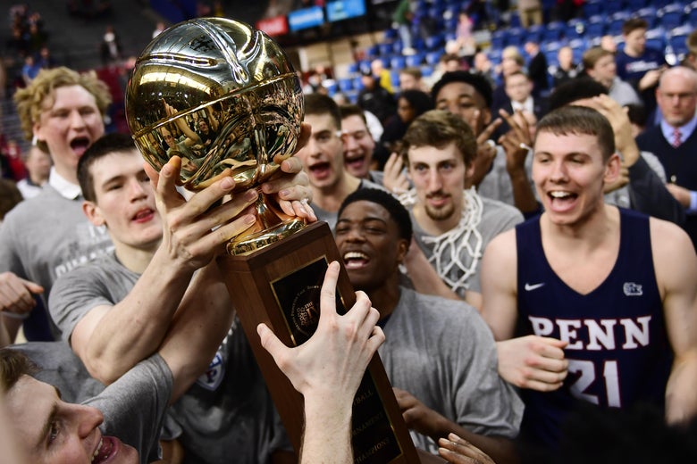 PHILADELPHIA, PA - MARCH 11: The Pennsylvania Quakers men's basketball team hold up the championship trophy after winning the Men's Ivy League Championship Tournament at The Palestra on March 11, 2018 in Philadelphia, Pennsylvania. Penn defeated Harvard 68-65. (Photo by Corey Perrine/Getty Images)